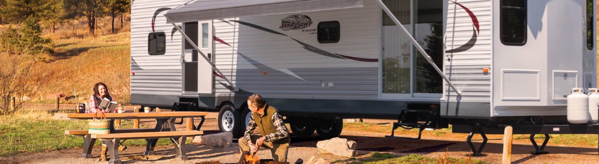 Jayco Jay Flight. Couple camping with a sunny day. Of Valley RV Supercenter at 619 Washington Ave N