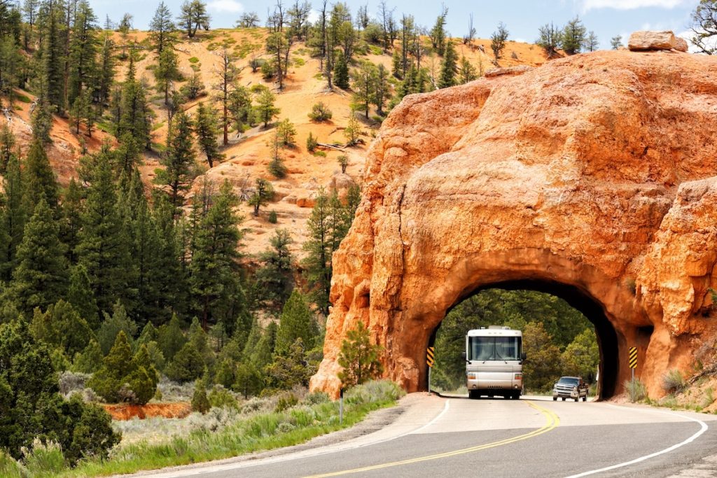 Canyon City, Utah, USA May, 21, 2016 A motor home driving through a tunnel in the redrock area Northwest of Bryce Canyon National Park in Utah.